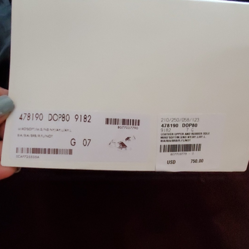 Gucci sneakers in it's original packaging.